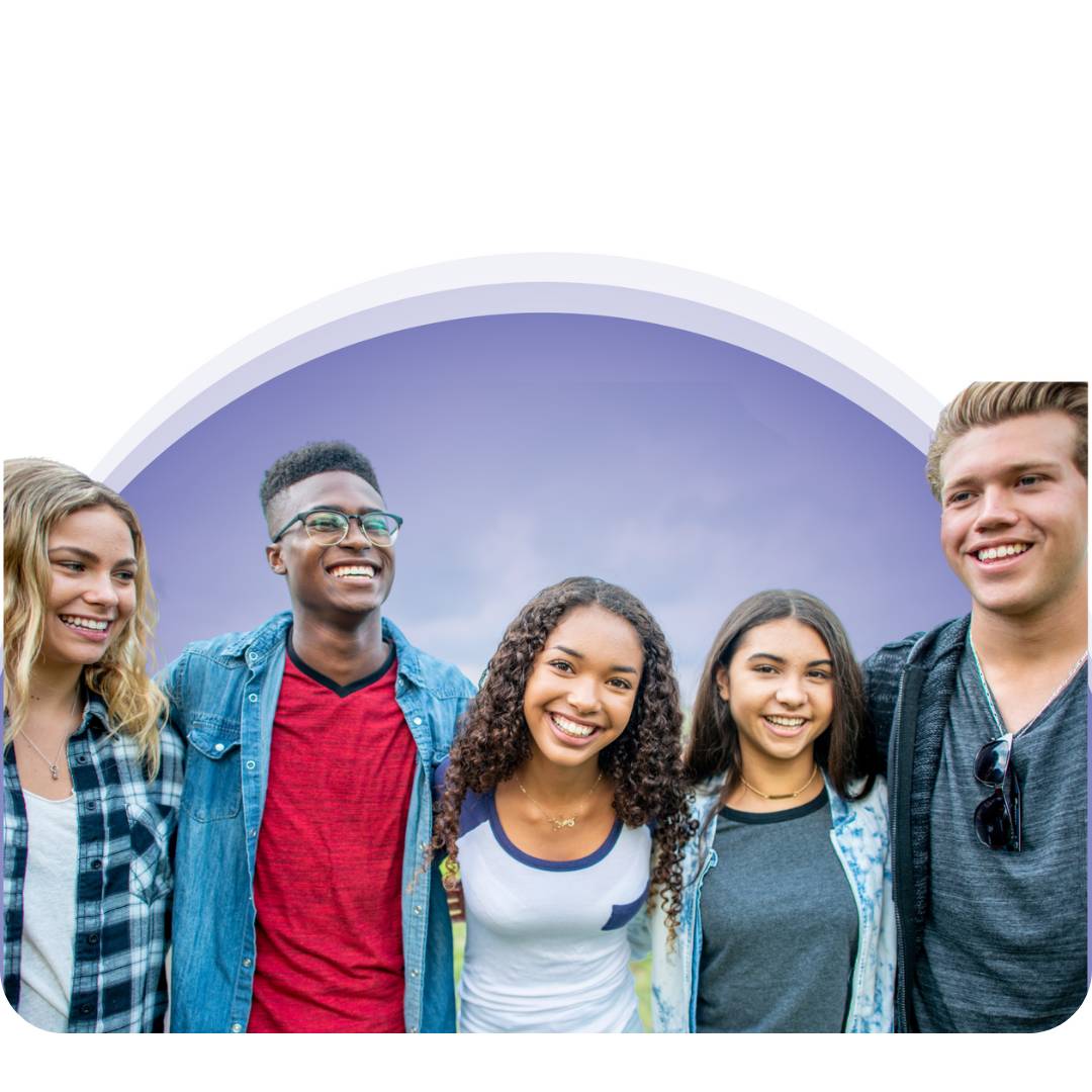 Group of teens smiling with a purple background